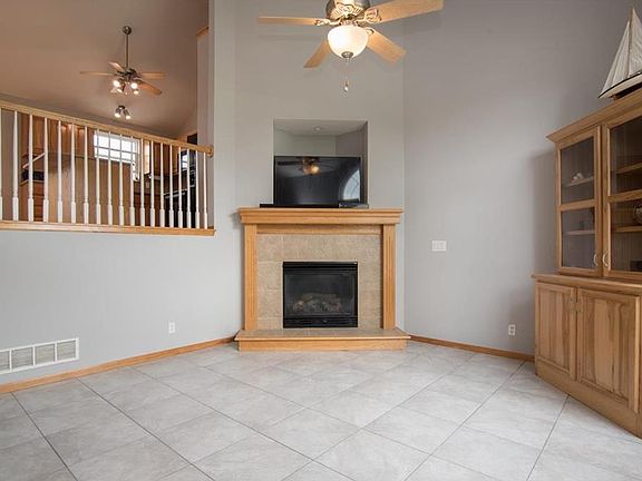 Great Room features a tiled floor, gas fireplace and vaulted ceiling.  Fresh paint week of 04/23/2017!