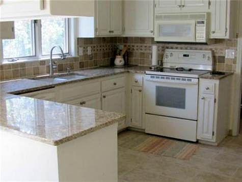 Kitchen with granite countertops and tile floor