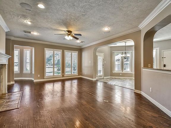 Large & open family room with custom fireplace.