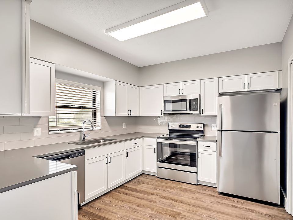 Select homes have upgraded kitchens with quartz countertops and wood flooring