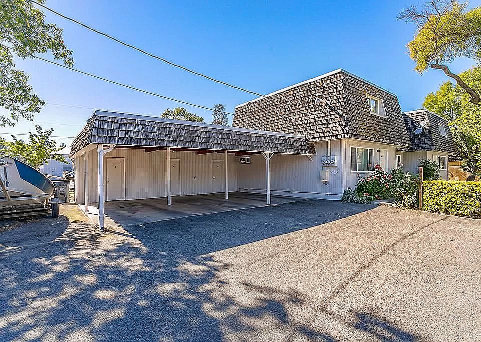 Carport parking with reserve storage closet.