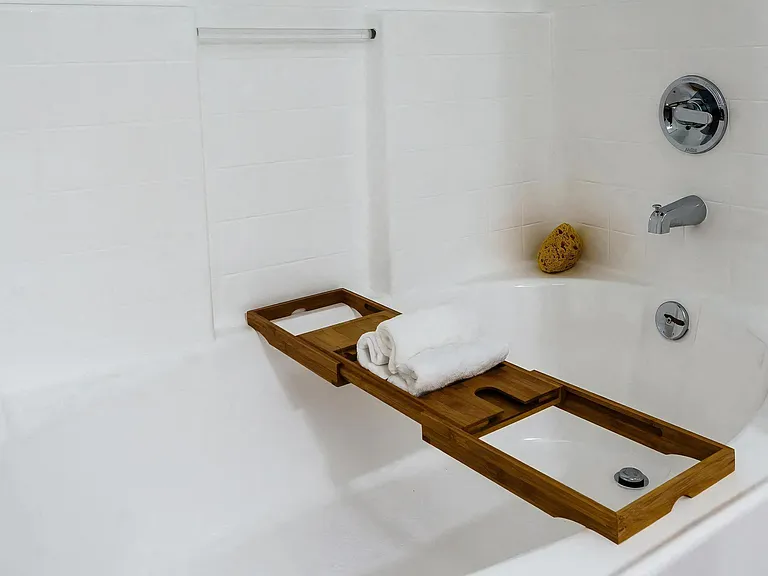 White Tile Bathroom with Oversized Tub and Relaxation Setup