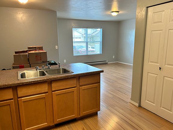 Kitchen looking out to dining and living areas. (boxes in dining area)
