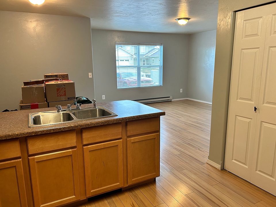Kitchen looking out to dining and living areas. (boxes in dining area)