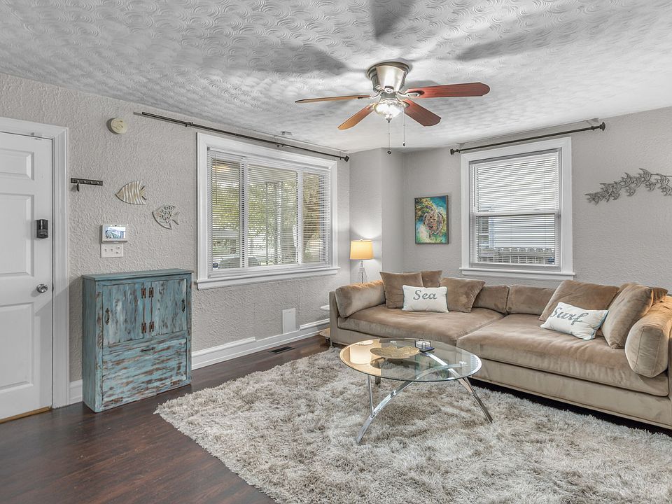 Giant comfy couch and spacious living room. Hardwood floors make it great for pets and people with allergies.
