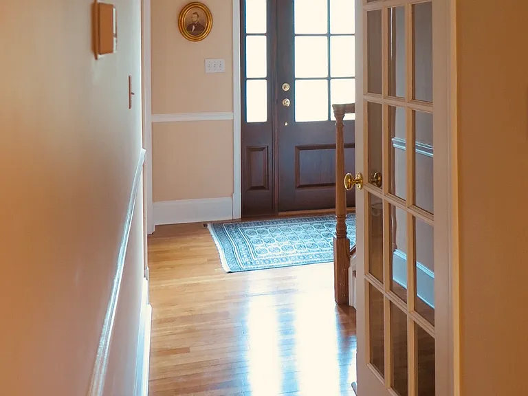 Center hallway looking at front door.