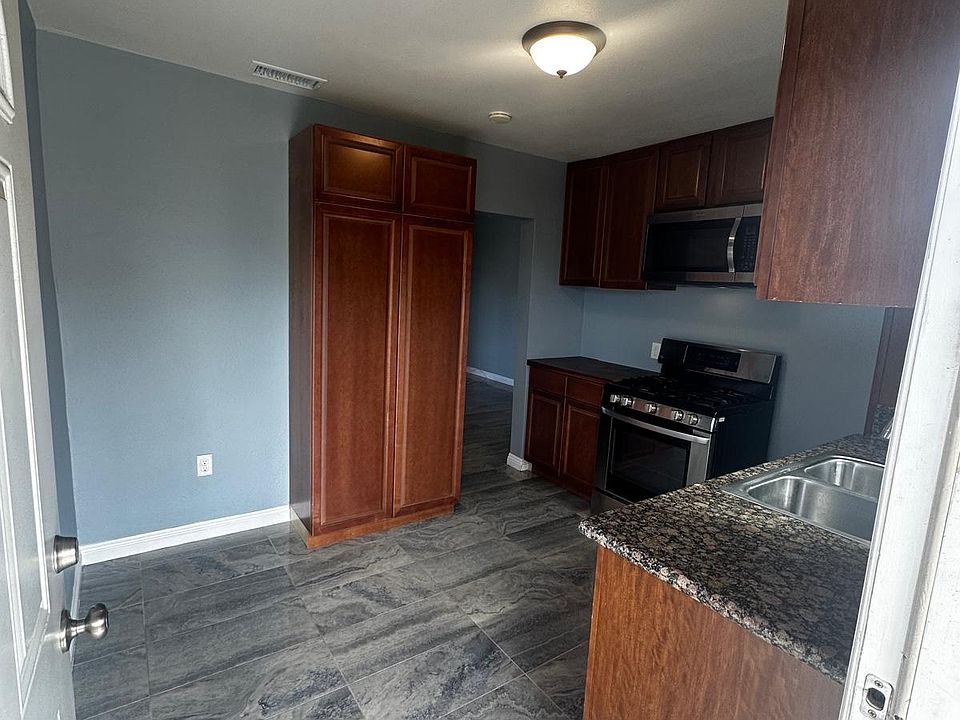 Kitchen area with updated cabinets.
