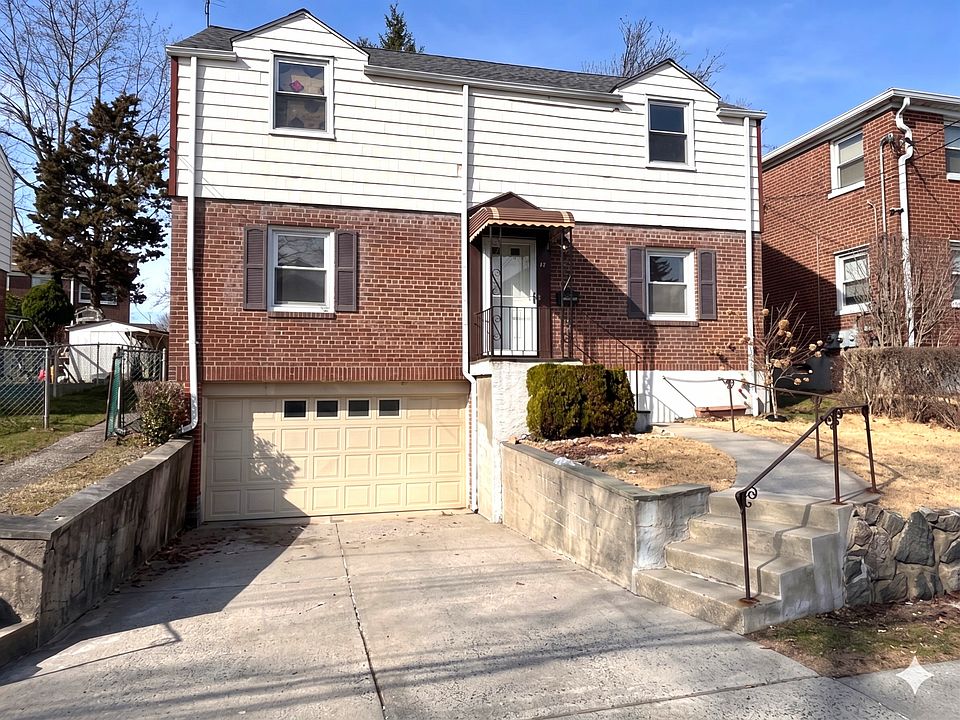Front of property.
Oversize driveway and garage with remote opener.