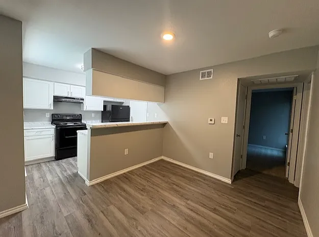 Spacious dining room with pass through kitchen bar, perfect for entertaining guests