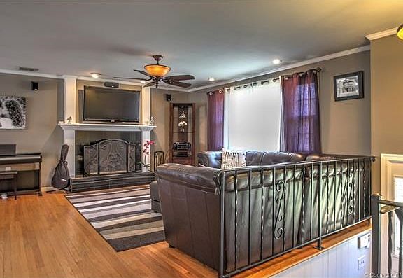 Formal living room with custom fireplace and large bay window!