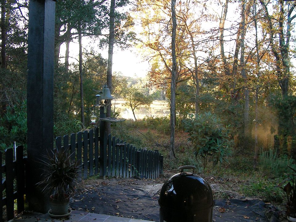 Marsh view of incoming tide from fenced back porch.