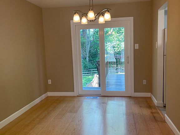 Dining room main floor with walk out to deck with stairs to the fenced in back yard