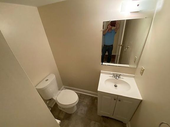 1st floor powder room. New floor, mirror, vanity toilet and sink. All freshly painted with nice closet for storage.