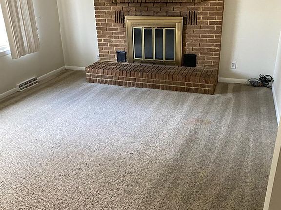 Living Room with wood burning Fireplace