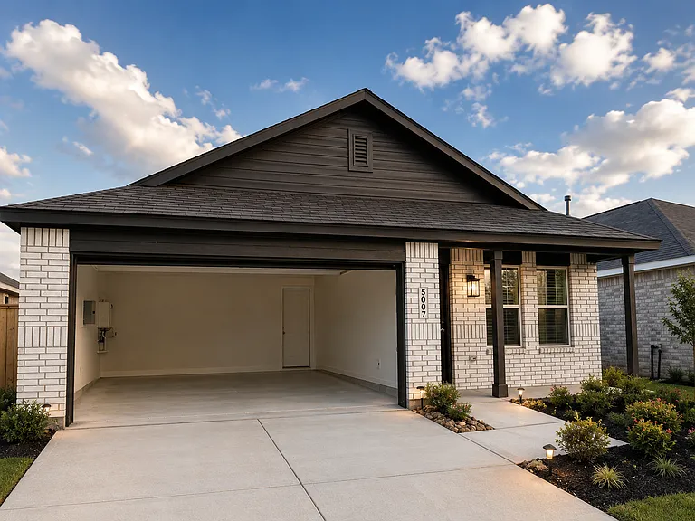 Attached two-car garage with ample room for vehicles, tools, and storage.