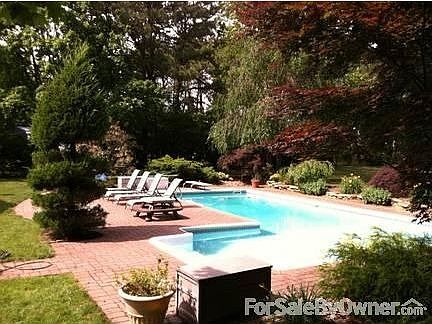 Backyard Paradise!
						:
						Large L shaped pool, surrounded by pavers and professionally landscaped yard.