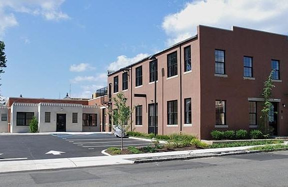 Unit 5 is in the smaller grey bldg, which attaches to main/large bring bldg. Unit can be accessed from 2 entrances.