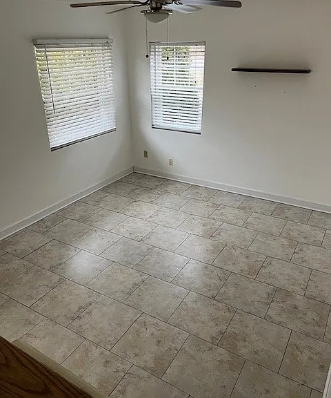 A centrally installed ceiling fan/light combo.
A new window air conditioner will be installed seasonally in the smaller window by the Landlord.