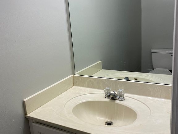 Downstairs features a half bath - perfect so that guests don_t have to go upstairs