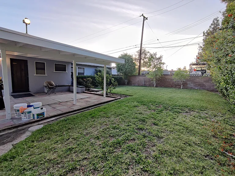 Cover patio in rear yard. Good-sized rear yard.