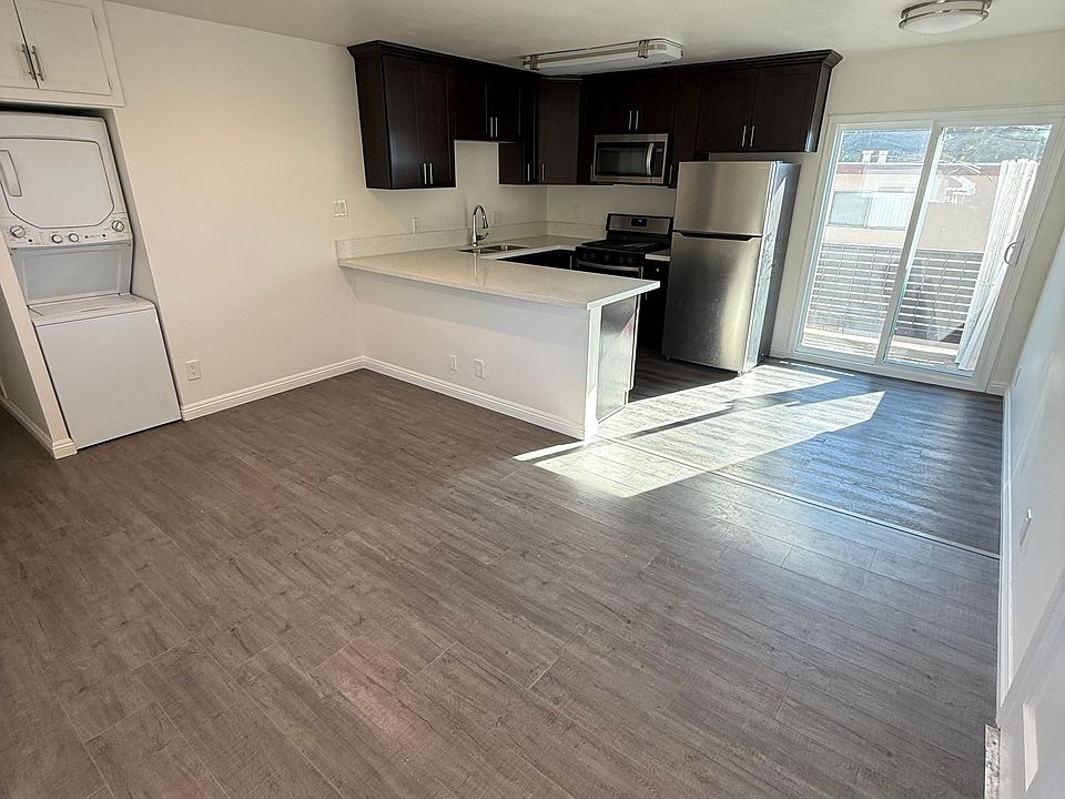 Living room/kitchen with private balcony