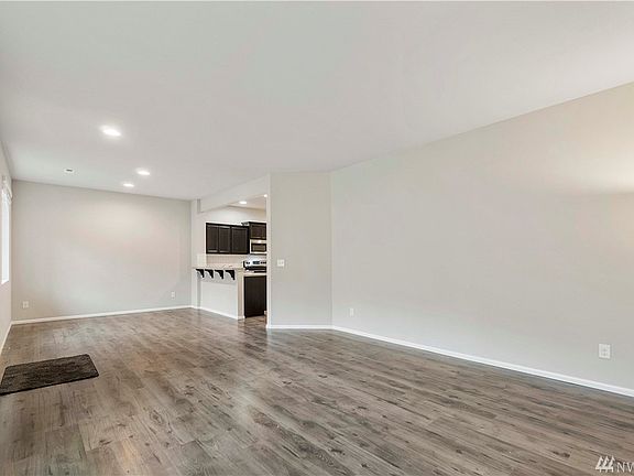 Beautiful floors greet you as you enter this open concept home, with recessed lighting, and high ceilings.