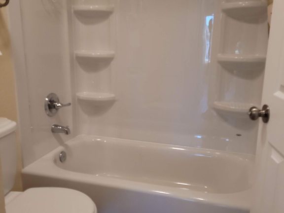 BATH WITH SHOWER AND TUB.