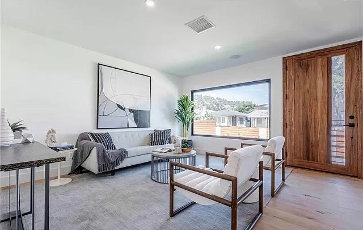 Walk in to a welcoming living space with a window looking out to the greenery of Elysian Park. - 2254 Harwood St