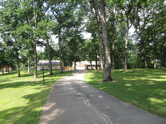 Driveway View
						:
						Long concrete driveway offers 4 lamp posts, each equipped with electrical outlet