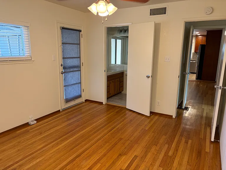 Bathroom off primary bedroom and door to backyard