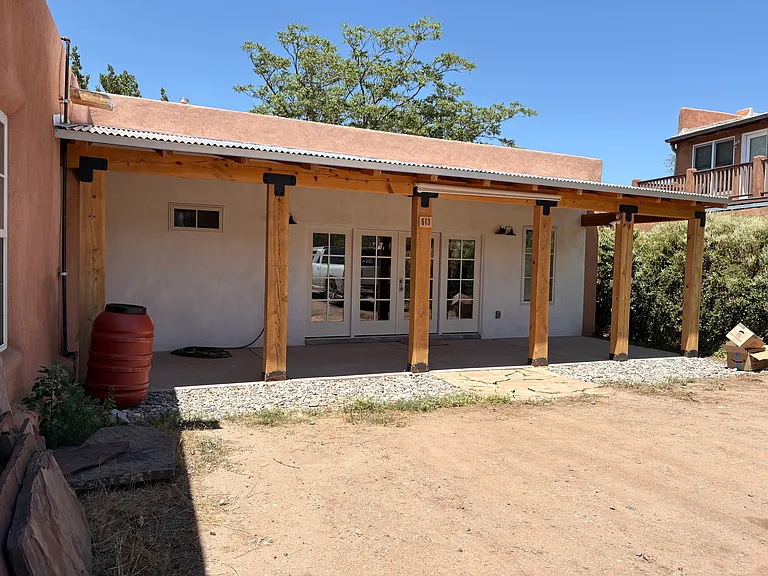 Porch on Eastside with entry to living room.