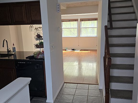 Entryway (kitchen to the left and half bath to right)