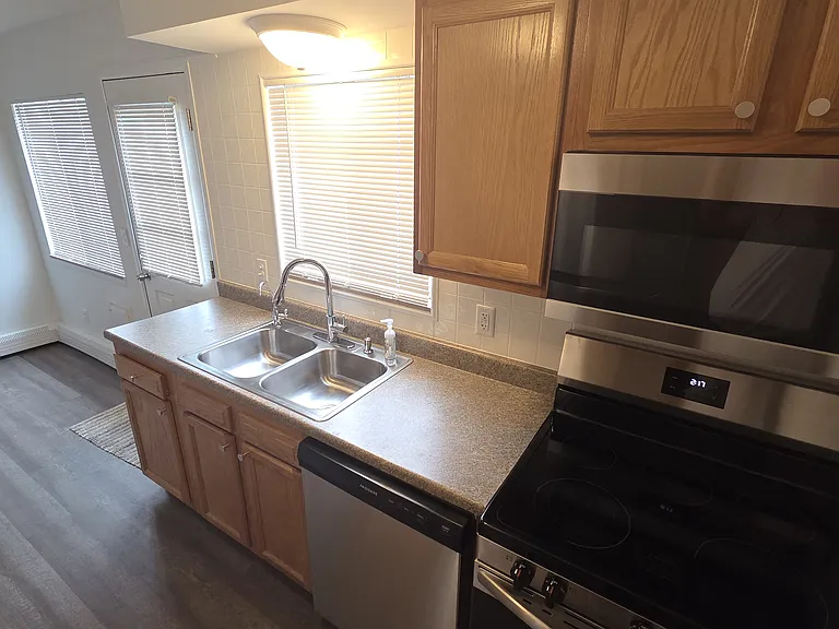 Double-basin sink, ample counter space, and brand-new appliances.