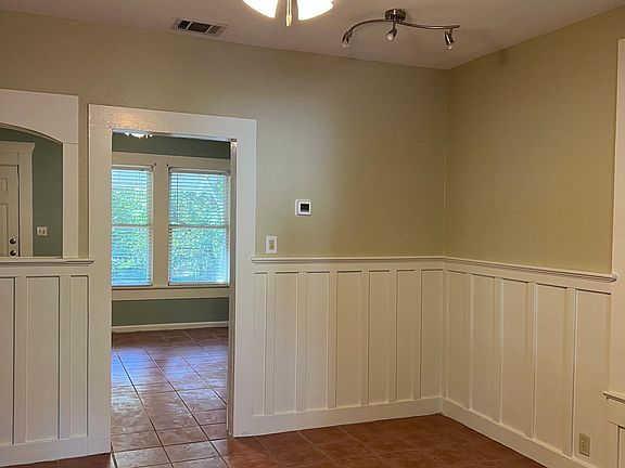 Original vintage wood wainscot in living room.