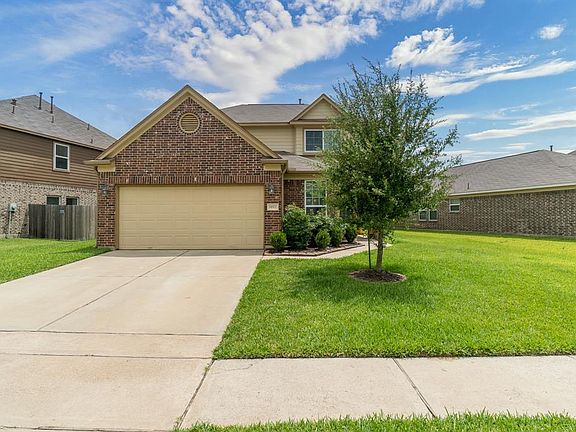 This home offers great curb appeal with a large front and side yard with mature trees and lush landscaping!