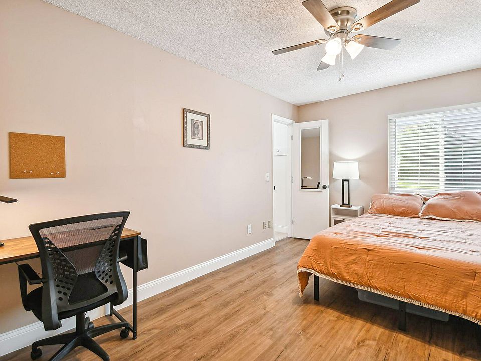 Vinyl floors, Full size bed, desk with office chair and light