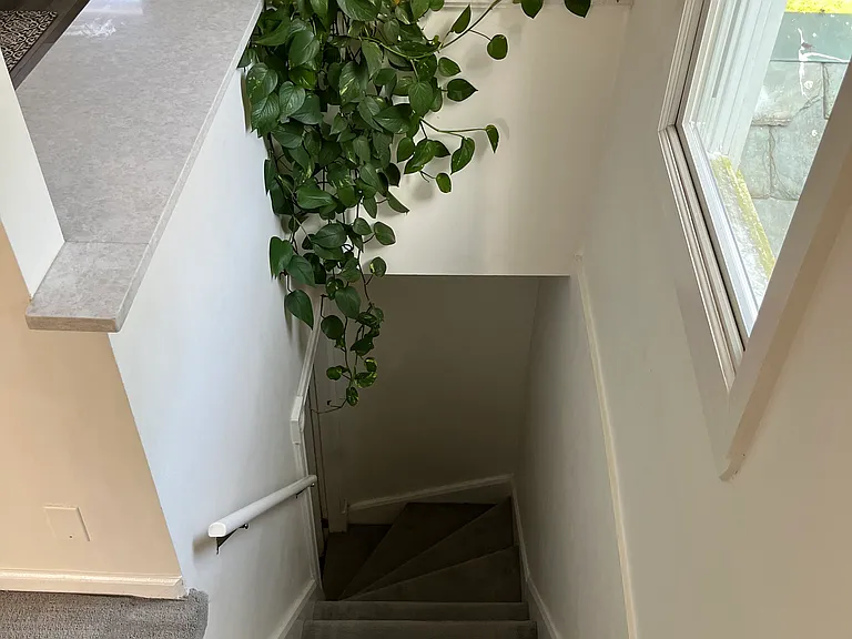 Staircase from the entrance hallway leading up to the apartment