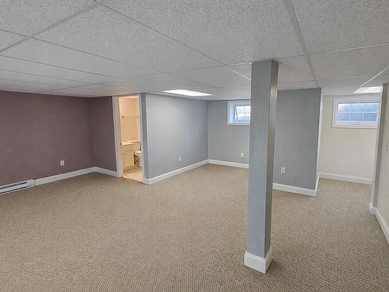Oversized primary bedroom with exceptional space for furniture, workspace, or seating area