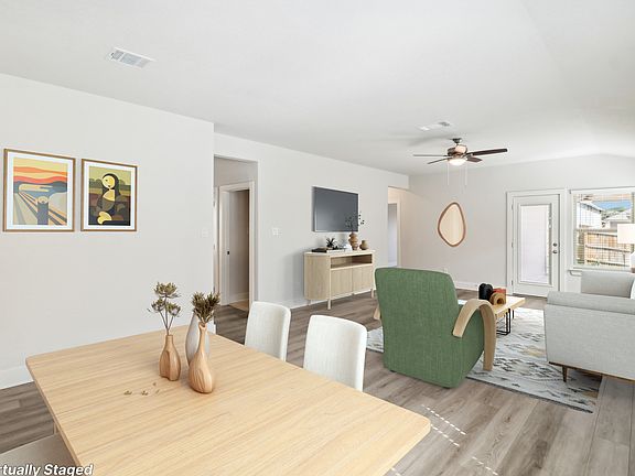 Virtually staged dining room in the Hughes floorplan at a Meritage Homes community.