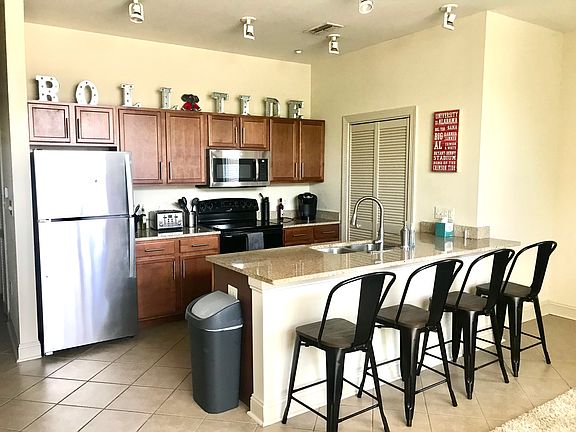 Kitchen area -- all new appliances including Microwave and full cooking/eating utensils