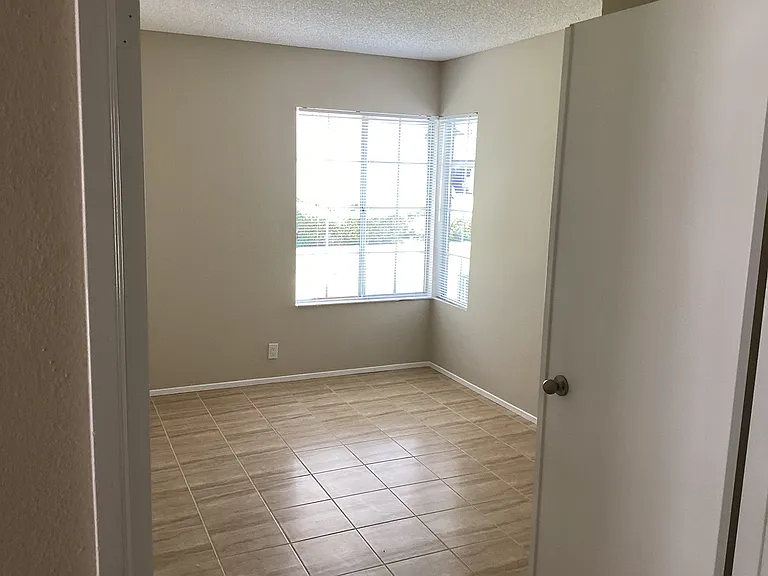 Downstairs bedroom with French Doors.
