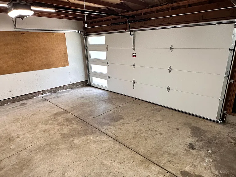 Two car garage has new, insulated door