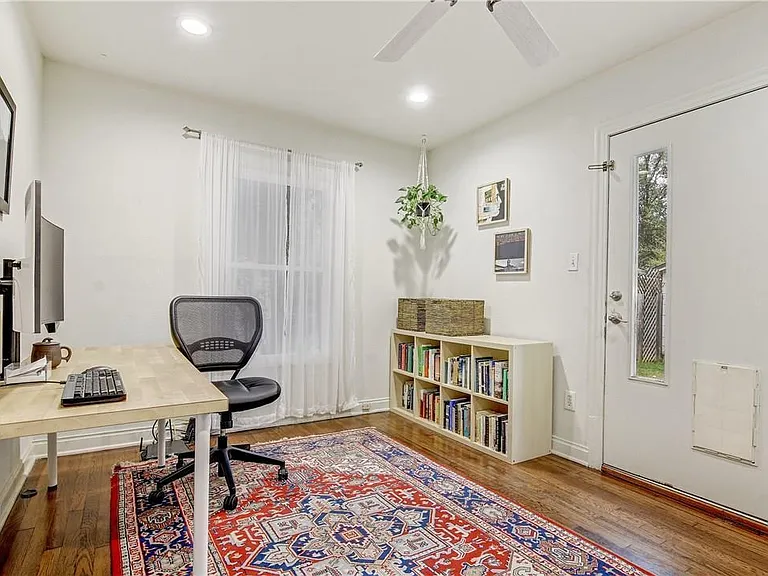 Second Bedroom, great as a bedroom or an office with a door that opens to the private fenced in backyard with large back patio