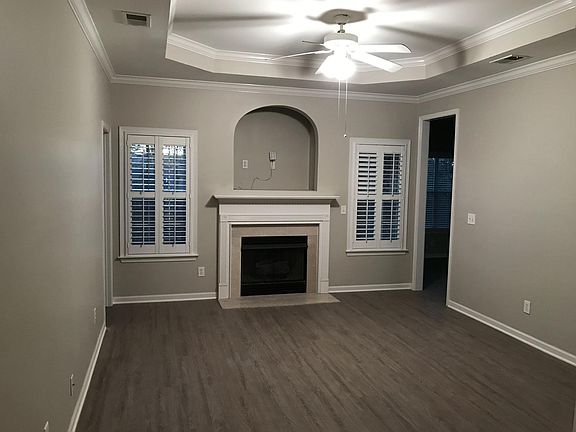 Large living room with tray ceilings