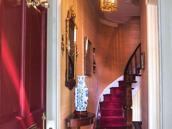Entry to center stair hall and living room
