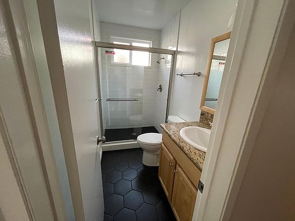 Bathroom #1 with a brand new walk in shower and new tile.