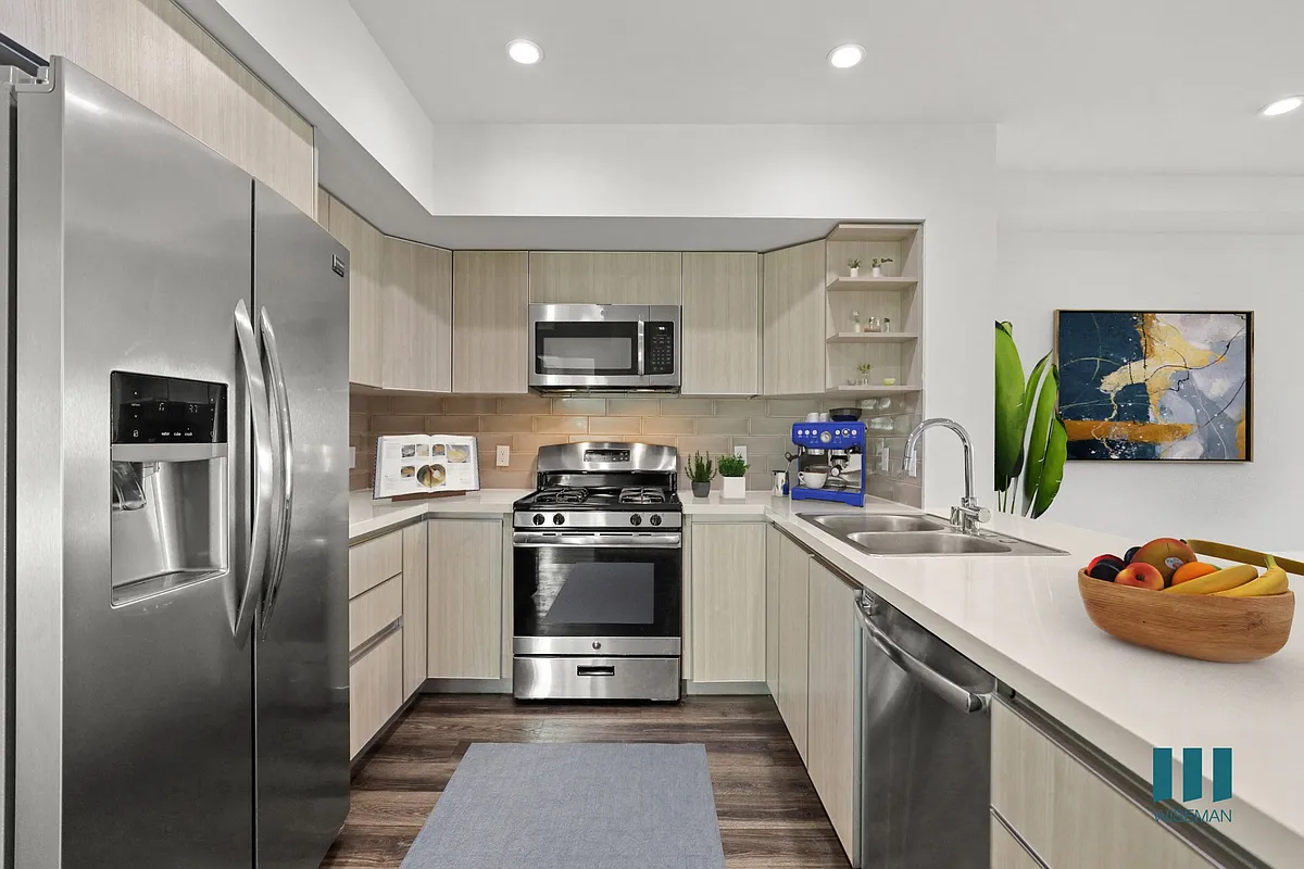 Open-Concept Kitchen with Countertop Bar, Energy-Efficient Appliances, and Ample Cabinet Storage - Hayworth Hyde by Wiseman