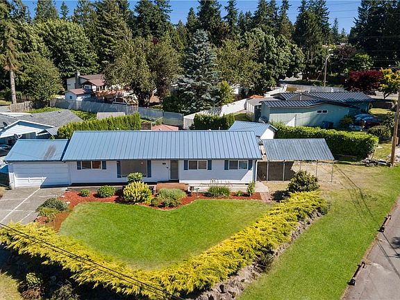 This large corner lot offers plenty of room for parking, including boat or RV.