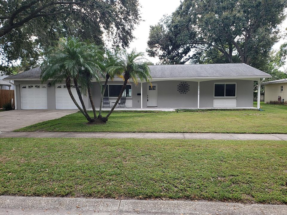 Newly rebuilt with new exterior, paver patio, new windows and doors, all new electrical, plumbing and A/C