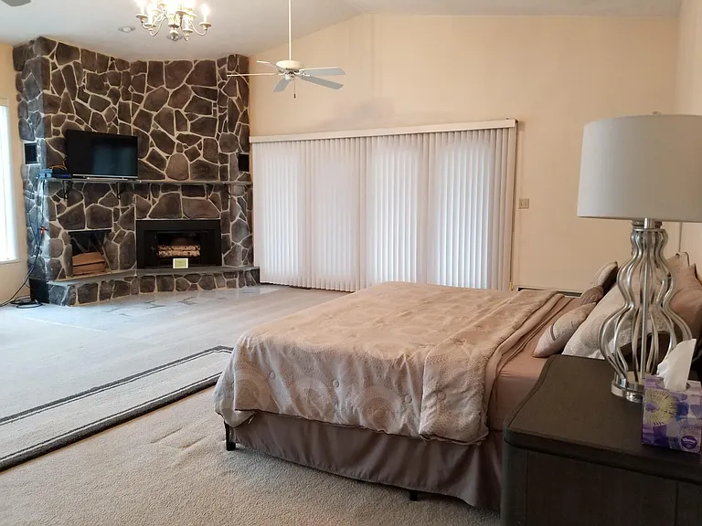 Master bedroom with fireplace/walk-in closet/balcony/ and master bathroom